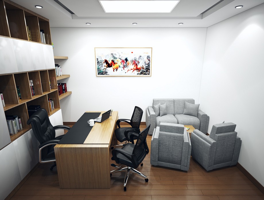 Phòng giám đốc nhỏ được thiết kế với bộ sofa nhỏ màu xám và bàn làm việc hiện đại